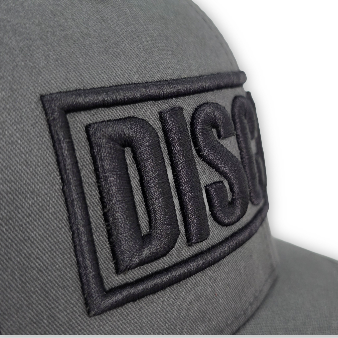 Disciple 3D Puff Embroidered Trucker Hat | Charcoal & Black